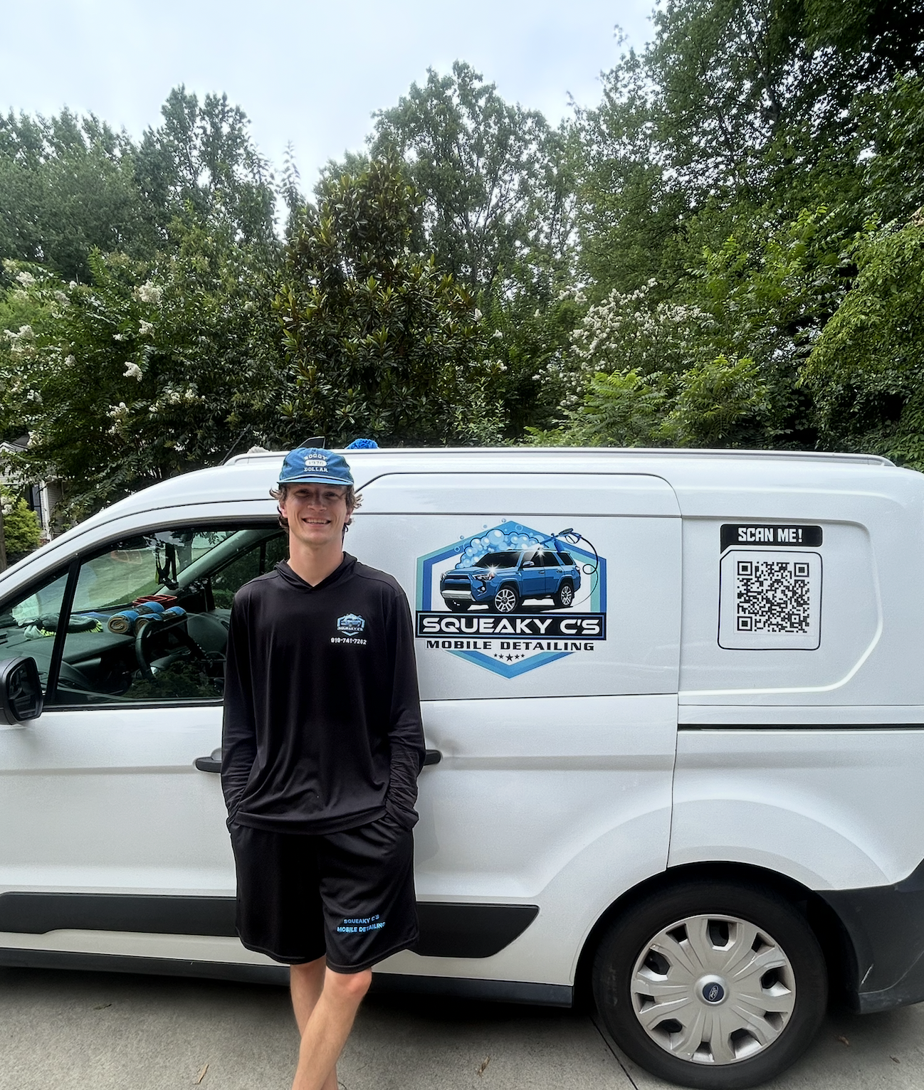 Chris standing next to the Squeaky C's Mobile Detailing van